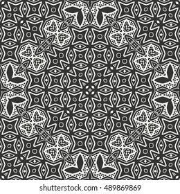 Black and white seamless lace pattern. Abstract geometric floral seamless background. Tribal ethnic ornate decoration, outline repeating texture. Vector doodle sketch pattern, graphic illustration