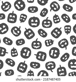 Black and white seamless pattern with carved Halloween pumpkins. Vector background on white.