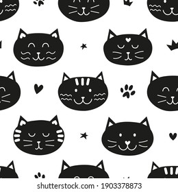 Black and white seamless pattern with cat faces and stars, hearts, paws for kid clothing, baby shower, wrapping paper.