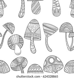 Black and white seamless pattern with decorative mushrooms for coloring book.
