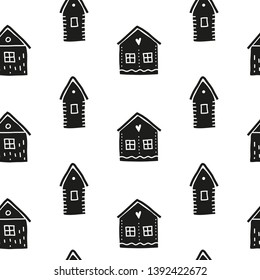 Black and white seamless pattern with doodle houses in scandinavian style.