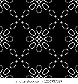 Black and white seamless pattern of dotted flowers and petals in trellis. Mosaic floral print of white dots. Geometric lattice print of beads. Vector Illustration.