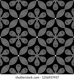 Black and white seamless pattern of dotted flowers and petals in trellis. Mosaic floral print of white dots. Geometric lattice print of beads. Vector Illustration.