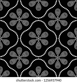 Black and white seamless pattern of dotted flowers and petals in trellis. Mosaic floral print of white dots. Geometric lattice print of beads. Vector Illustration.