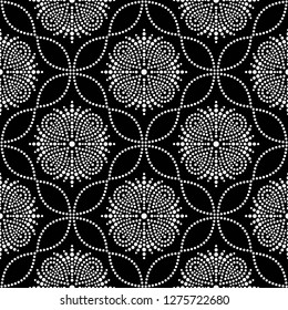 Black and white seamless pattern of dotted flowers, leaves, snowflakes, stars in trellis. Mosaic floral print of white dots. Geometric lattice print of beads. Vector Illustration.