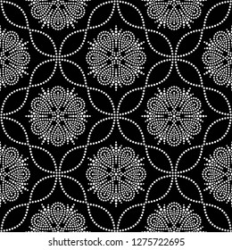 Black and white seamless pattern of dotted flowers, leaves, snowflakes, stars in trellis. Mosaic floral print of white dots. Geometric lattice print of beads. Vector Illustration.