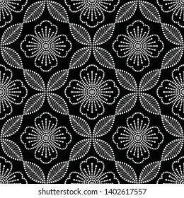 Black and white seamless pattern of dotted flowers in trellis. Mosaic floral print of white dots. Delicate print of flowers, leaves and petals. Vector Illustration.