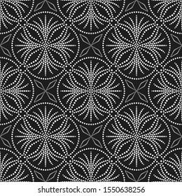 Black and white seamless pattern of dotted flowers in trellis. Mosaic floral print of white dots. Delicate lace print of beads. Vector Illustration.