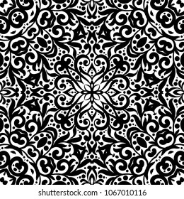 Black and white seamless pattern with flourishes, monochrome intricate background. Tribal ethnic ornament, decorative repeating texture endless tile, eastern exquisite style wallpaper or texture.