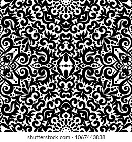 Black and white seamless pattern with flourishes, monochrome intricate background. Tribal ethnic ornament, decorative repeating texture endless tile, eastern exquisite style wallpaper or texture.