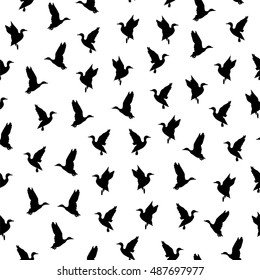 Black and white seamless pattern with flying bird. Wild ducks for hunt design. Outline style. Stock vector illustration.