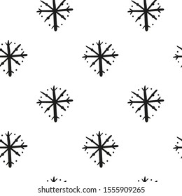Black and white seamless pattern with hand drawn scribble ink snowflakes.
