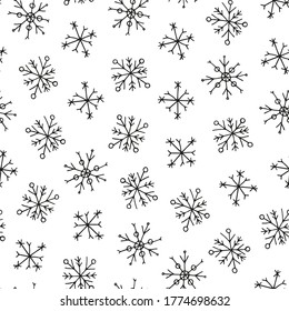 Patrón transparente blanco y negro con copos de nieve con tinta garabateada a mano.