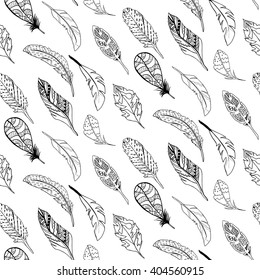 Black and white seamless pattern with hand-drawn feathers. Boho style vector image.