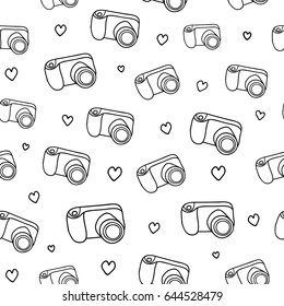 Black and white seamless pattern with outline doodle photo cameras, hearts.