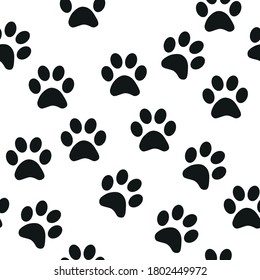 Black and white seamless pattern with paw prints. Abstract background, animal footprint