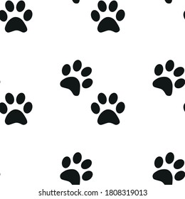 Black and white seamless pattern with paw prints. Abstract background, animal footprint