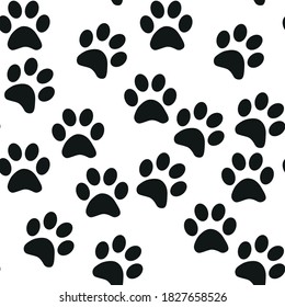 Black and white seamless pattern with paw prints. Abstract background, animal footprint