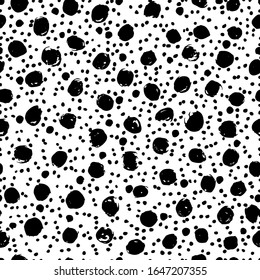 Black and white seamless pattern in polka dot style. Dots, blots drawn with a brush on paper. Cute print for textiles, packaging, wallpapers. Vector illustration.