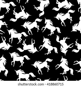 Black and white seamless pattern with realistic silhouettes of unicorns.