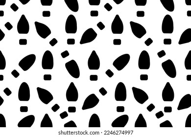 Black and white seamless pattern with traces of shoes Creative print for wallpaper in the shoe repair shop. Pathfinder concept. Print of bed linen and fabric.