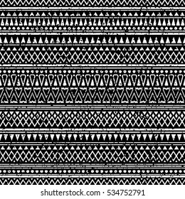 Black and white seamless pattern with tribal aztec ornament and shabby effect.