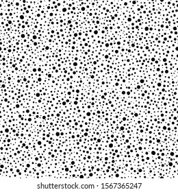 Black and white seamless polka dot pattern. Random ink circles and splashes. Cute simple doodle style pattern. Small, tiny specks. Background for textile. Vector illustration.