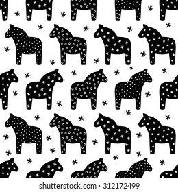 Black and white seamless scandinavian style pattern with traditional horses and snowflakes. Swedish Dala or Daleclarian horse seamless folk art pattern.