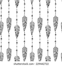 Black and white seamless texture with ornaments from bird feathers in tribal style. Feathers. Vector illustration.