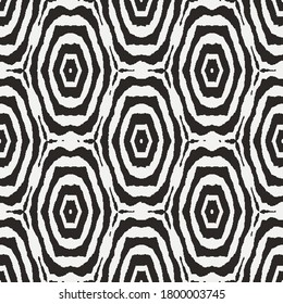 Black and white seamless vector abstract pattern with target shapes mosaic. Unisex graphic surface print design for fabrics, textiles, backgrounds, stationery, gift wrap, and packaging.