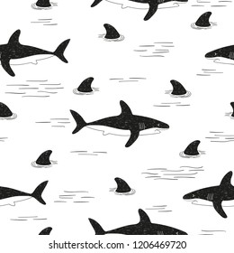 Black and white seamless vector doodle shark pattern.