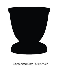 A black and white silhouette of an egg cup