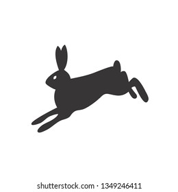 Black and white silhouette of a fluffy rabbit or hare sitting on a white background. Suitable as a logo, icon or design element of your design Projects.
