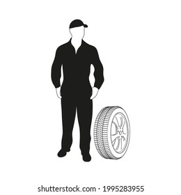 Black and white silhouette of a male character in overalls standing next to a wheel on a white background