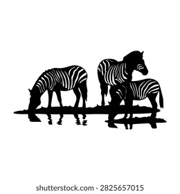 Black and white silhouettes of three zebras standing near water, showcasing their distinctive striped patterns and natural habitat in the wild.