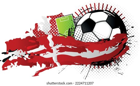 Black and white soccer ball surrounded by red and white spots forming the flag of Denmark with a soccer field in the background