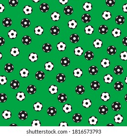 Black and white soccer balls pattern on green background. Vector illustration.