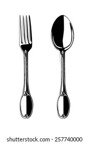 Black and white spoon and fork isolated on white background.
