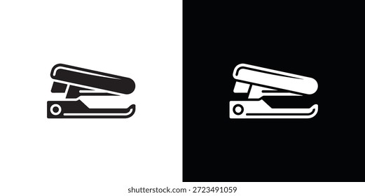 Black and white stapler on contrasting backgrounds