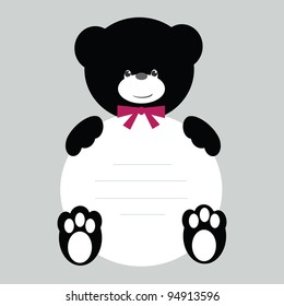 Black and white teddy bear with banner