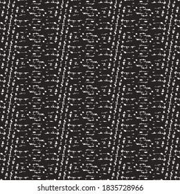 Black and white textile material decorated with stripes and marks made of stitches. Old fashioned cloth.