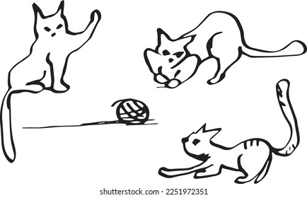 Black and white three funny playing with a ball cats