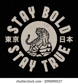 Black and White Tiger on Rocks Illustration with Stay Bold Stay True Slogan and Japan and Tokyo Words with Japanese Letters Vector Artwork on Black Background for Apparel and Other Uses