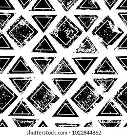 Black and white triangles and squares aged geometric ethnic grunge seamless pattern, vector