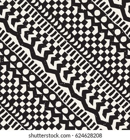 Black and white tribal vector seamless pattern with doodle elements. Aztec abstract geometric art print. Ethnic ornamental hand drawn backdrop.