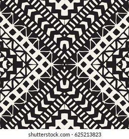 Black and white tribal vector seamless pattern with doodle elements. Aztec abstract geometric art print. Ethnic ornamental hand drawn backdrop.