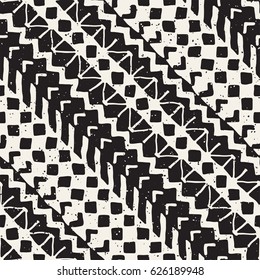 Black and white tribal vector seamless pattern with doodle elements. Aztec abstract geometric art print. Ethnic ornamental hand drawn backdrop.