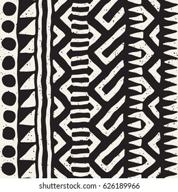 Black and white tribal vector seamless pattern with doodle elements. Aztec abstract geometric art print. Ethnic ornamental hand drawn backdrop.