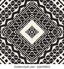 Black and white tribal vector seamless pattern with doodle elements. Aztec abstract geometric art print. Ethnic ornamental hand drawn backdrop.