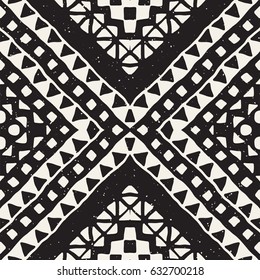 Black and white tribal vector seamless pattern with doodle elements. Aztec abstract geometric art print. Ethnic ornamental hand drawn backdrop.